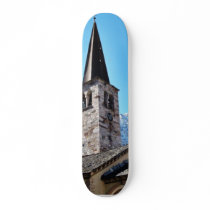 Church Tower In A Village In The Alp Mountain skateboards by lifesphere Church Tower In A Village In The Alp Mountain skateboards