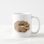 Circle of cookies on a white background mugs
