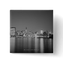 City skyline at night button