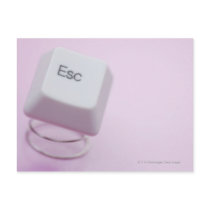 Close-up of an escape key postcard