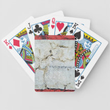 Close-up of cracked concrete wall bicycle poker cards