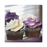 Close-up of cupcakes with selective focus on refrigerator magnets