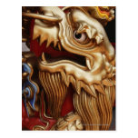 Close up of gold dragon on temple pillar postcard