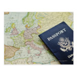 Close-up of passport lying on European map Postcard