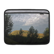 Clouds over mountains in summer evening sleeves for MacBook air