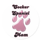 round_sticker - As sentimental as a child's hand print is, so is a dog's paw print. Pretty in pink for that Cocker Spaniel Mom, she will love this dog parent design.