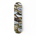 Coins Hammered Into A Trunk Skate Board Deck