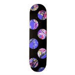 Colorful blue circles on black skateboard deck