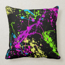 Colorful Neon Paint Splatters on Black Pillow