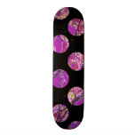 Colorful purple circles on black skateboard