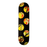 Colorful yellow circles on black skateboard deck