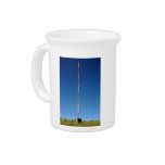 Communication tower against blue sky beverage pitchers