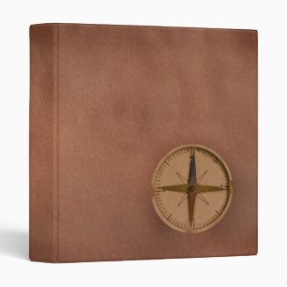 compass on old paper binder