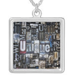 Composition of letterpress blocks jewelry