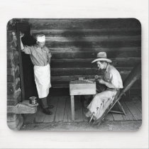 Cook watching a cowboy play cards mousepads