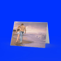 Couple in Love Walking on Beach into the Sunset Greeting Cards