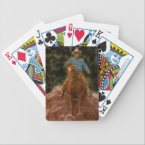 Cowboy sliding to stop playing cards