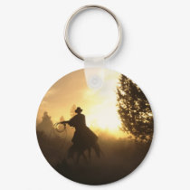 Cowboy with Lasso in Sunset keychains