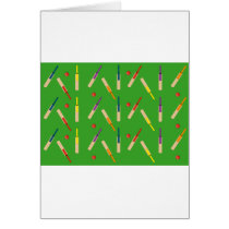Cricket bats/ balls with green background Card