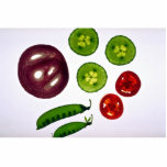 Cucumbers, tomatoes, snow peas and red onion cut out