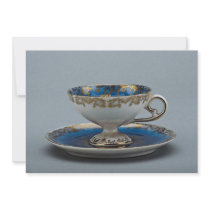 Cup and saucer with colorful designs invite