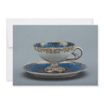 Cup and saucer with colorful designs invite