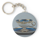 Cup and saucer with colorful designs key chains