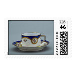 Cup and saucer with colorful designs stamps