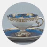 Cup and saucer with colorful designs round sticker