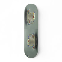 Cup and saucer with colorful flower designs on it. skate board