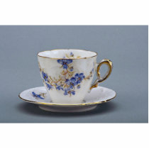 Cup and saucer with colorful flower designs photo sculptures