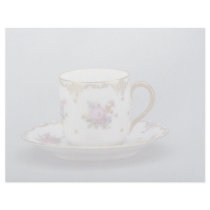 Cup and saucer with colorful flowers on it. letterhead design