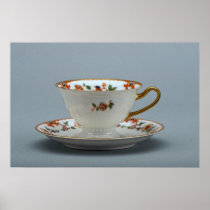 Cup and saucer with colorful flowers on it. poster