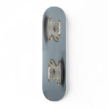Cup and saucer with colorful flowers on it. skate boards