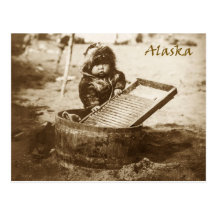 Curious Eskimo child with washboard Post Card