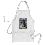 Cute baby macaque monkey enjoying banana aprons
