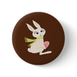 Cute little Easter bunny holding a pink egg button