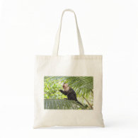 Cute Monkey on a Palm Tree Bags