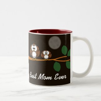 Cute owl with baby on green tree in moon light coffee mug