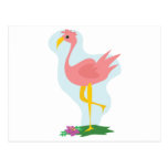 cute pink flamingo standing in the yard postcards