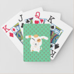 Cute shaggy dog playing cards