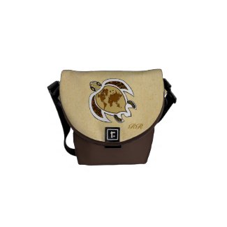 A cute turtle on a sandy beige beach on a Rickshaw Mini Zero Messenger bag