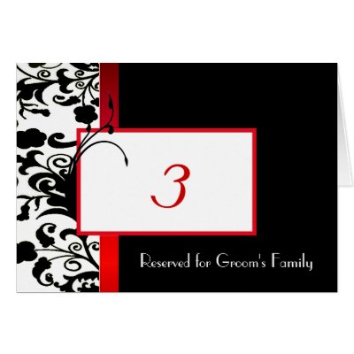 Stylish wedding reception table number card done in a black and white damask 