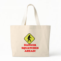 Danger squatches ahead tote bags