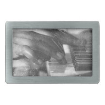 dark skin hands bw playing piano keyboard grunge belt buckles