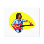 Dark skinned guitar player tuning pink red guitar stretched canvas print