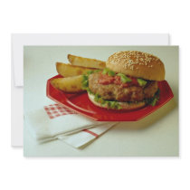 Delicious Breaded fish on a bun with fries Invite
