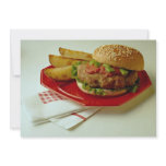 Delicious Breaded fish on a bun with fries Invite