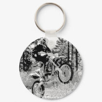 Dirt bike wheeling in the woods keychains