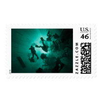 Divers in a tunnel postage stamp
